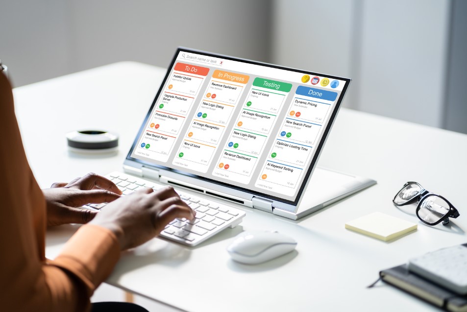 A project manager works on a project spreadsheet for International Project Management Day