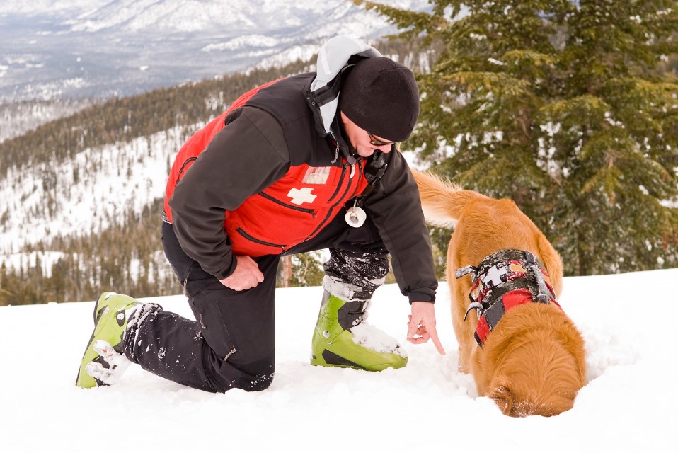 Ski Patroller with rescue dog for Ski Patrol Day