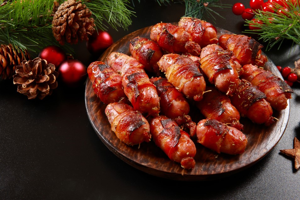 A bowl of cocktail sausages wrapped in bacon for Pigs in Blankets Day